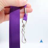 Holding purple flat lanyard with swivel clip