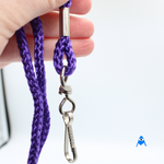 Holding purple lanyard with swivel clip